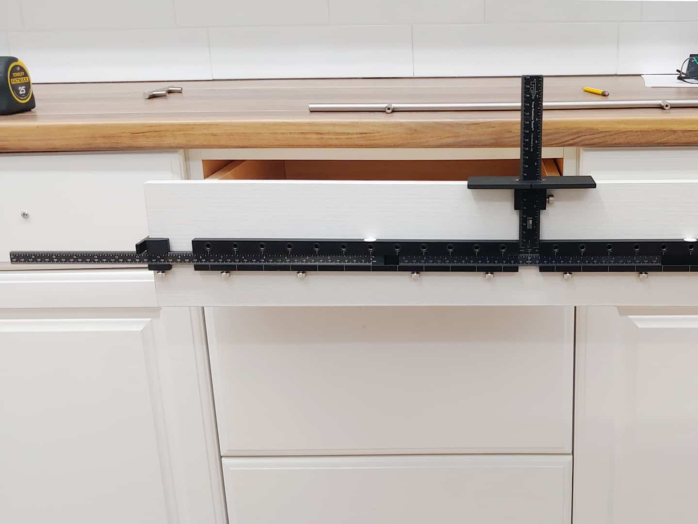 long handle installation on cabinet drawer with TP-1934 Cabinet Hardware Jig (step 4)