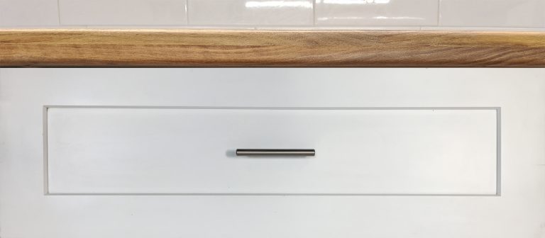 Shaker style cabinet drawer front handle pull installed