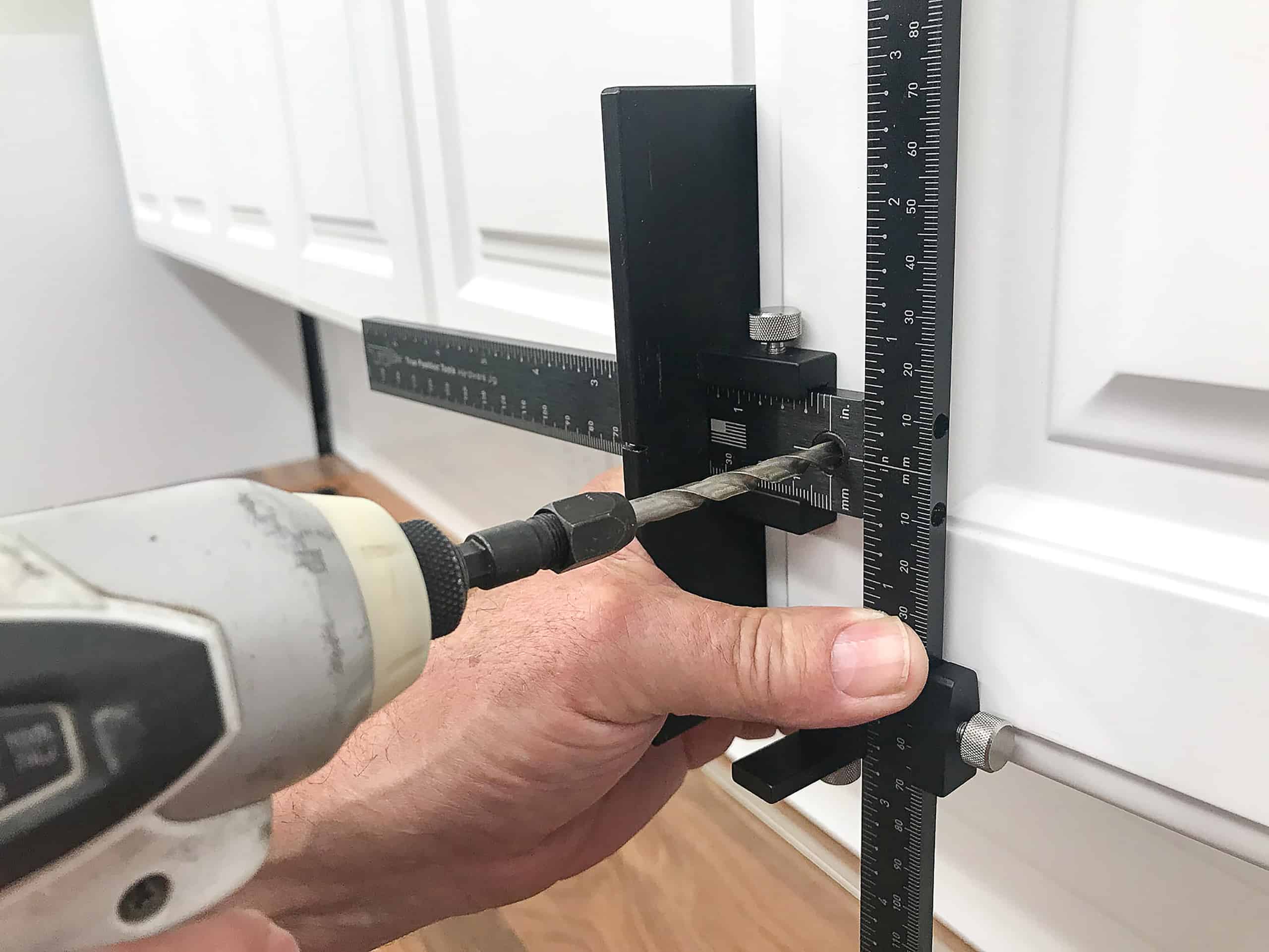 TP 1934 cabinet hardware jig drilling on white kitchen cabinet door